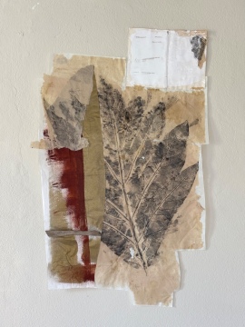 Breadfruit Leaf and a book with words that cannot be seen
